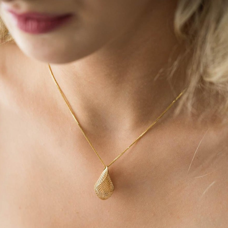 model wearing 18k yellow gold - Unique Contemporary, Statement, basket Pendant on Spiga chain